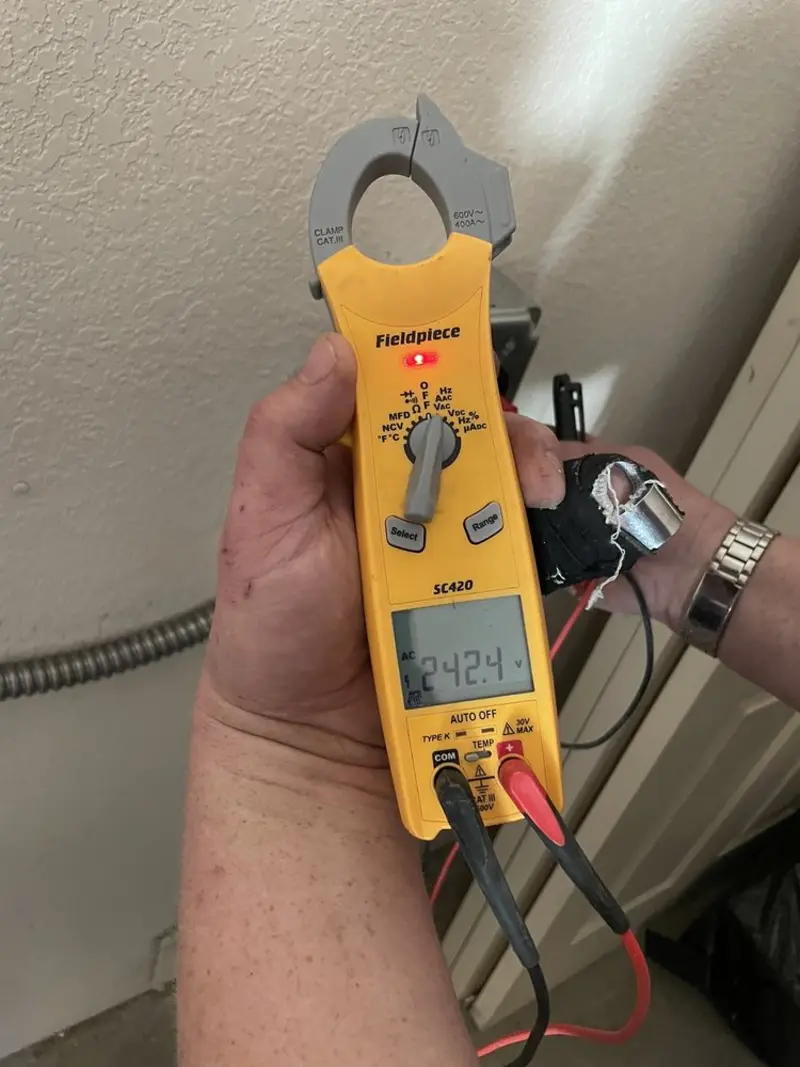Voltage testing with clamp meter during Circuit Breaker Repair in Effingham